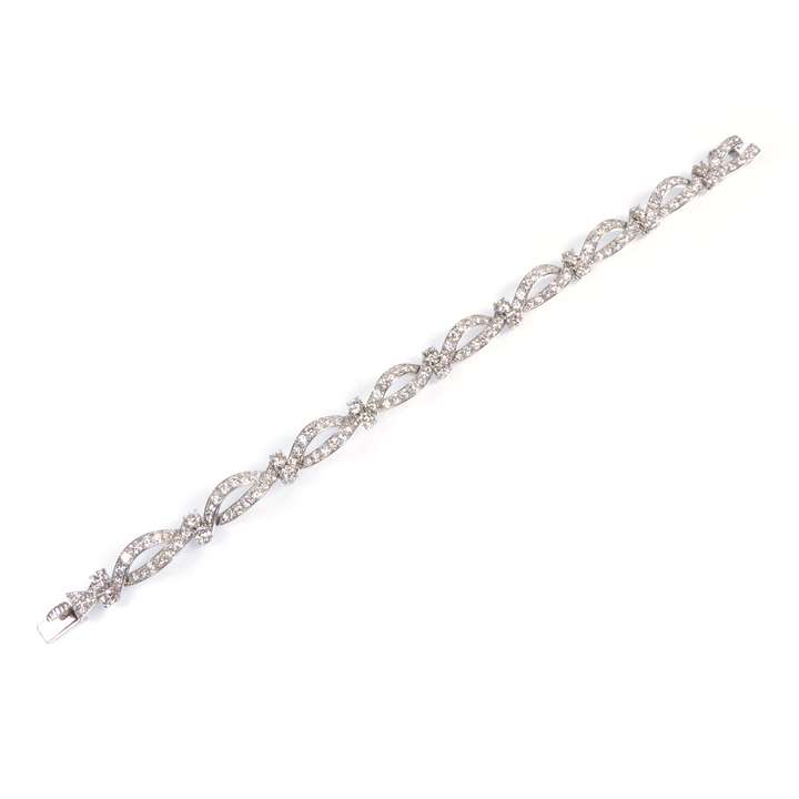 Diamond scroll bracelet forming navette links